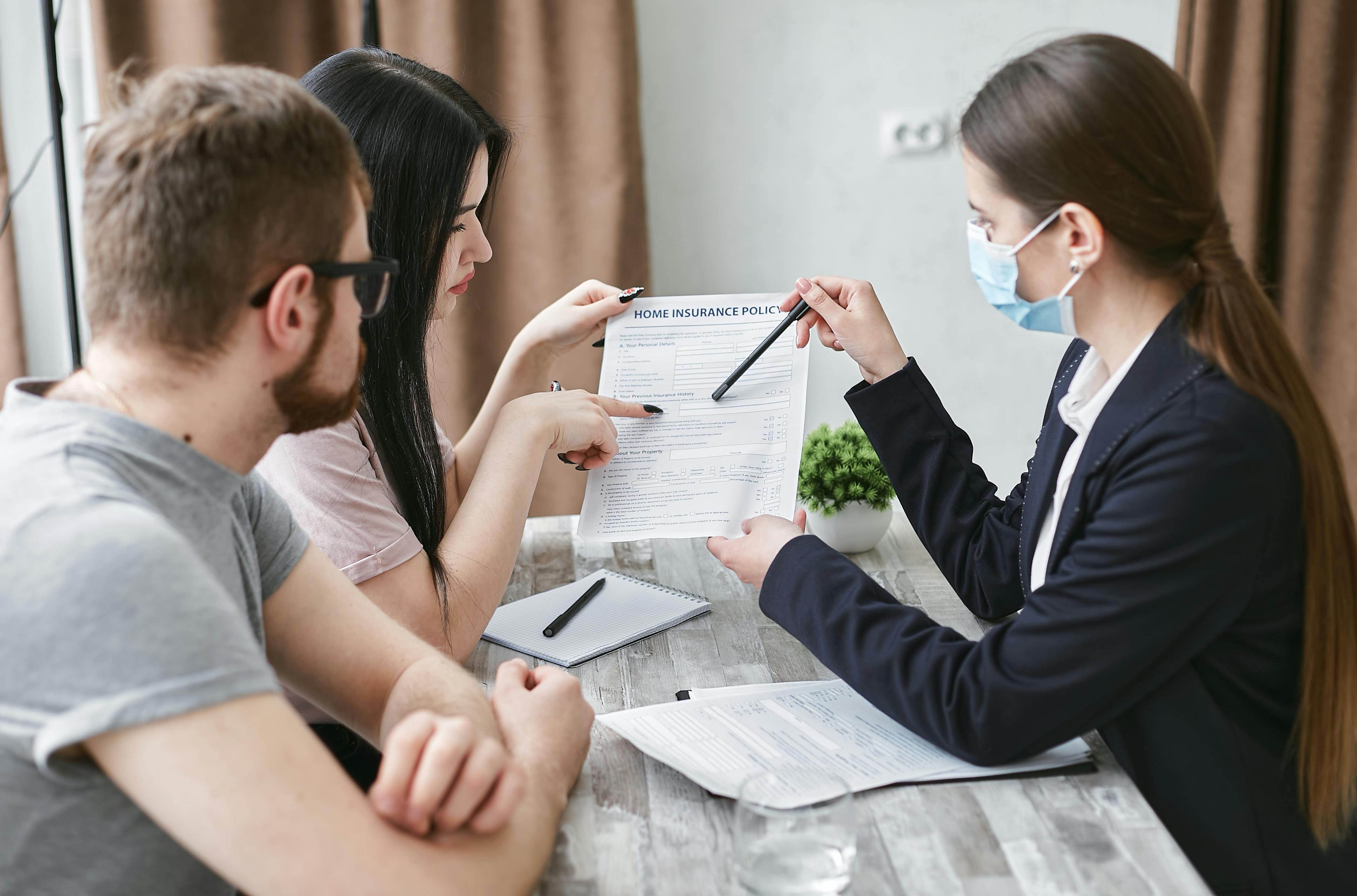 Insurance advisor consulting with clients